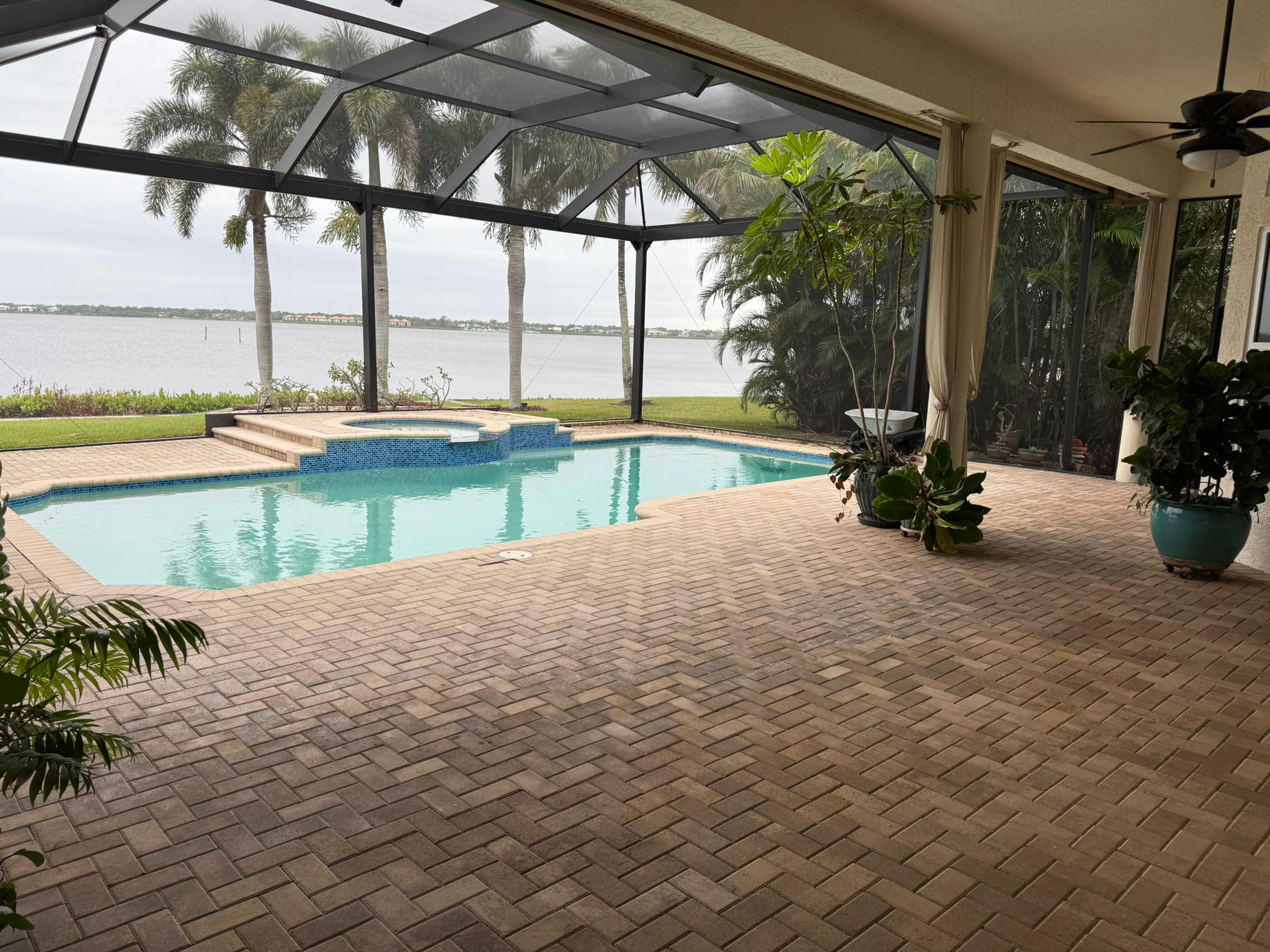 Pool technician opening backyard pool in Vero Beach