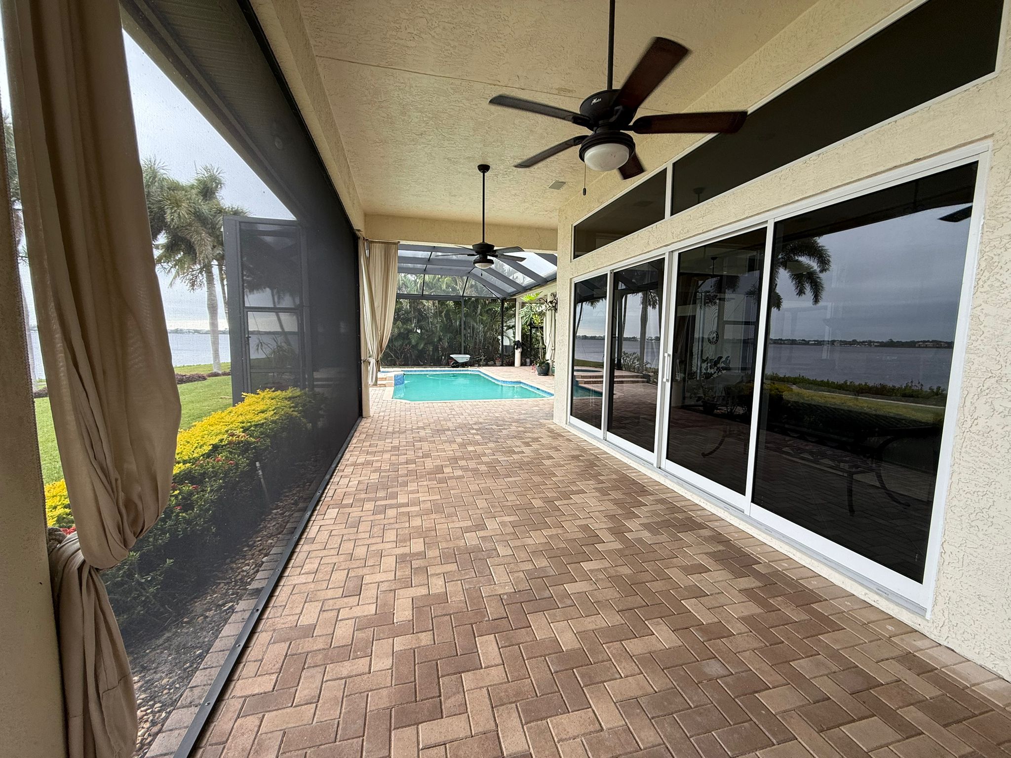 Pool renovation in Jensen Beach backyard with resurfaced deck
