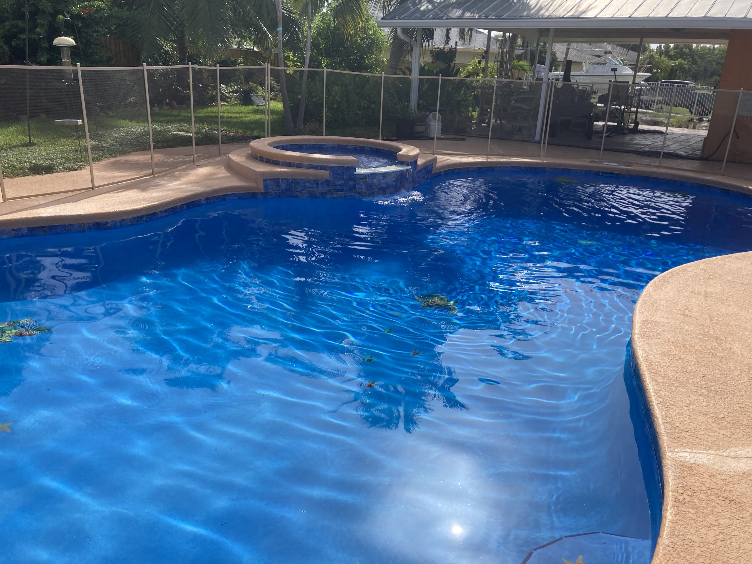 Resurfaced swimming pool with pebble finish in Stuart, Florida